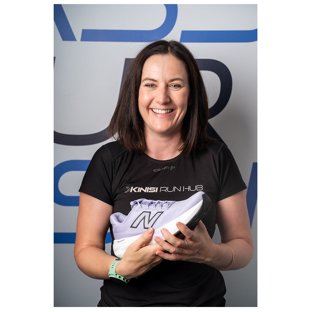 Photograph of Joanne at Kinisi Run Hub holding a running shoe.