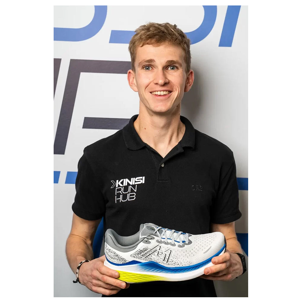 Image of Jamie from Kinisi Run Hub holding a running shoe