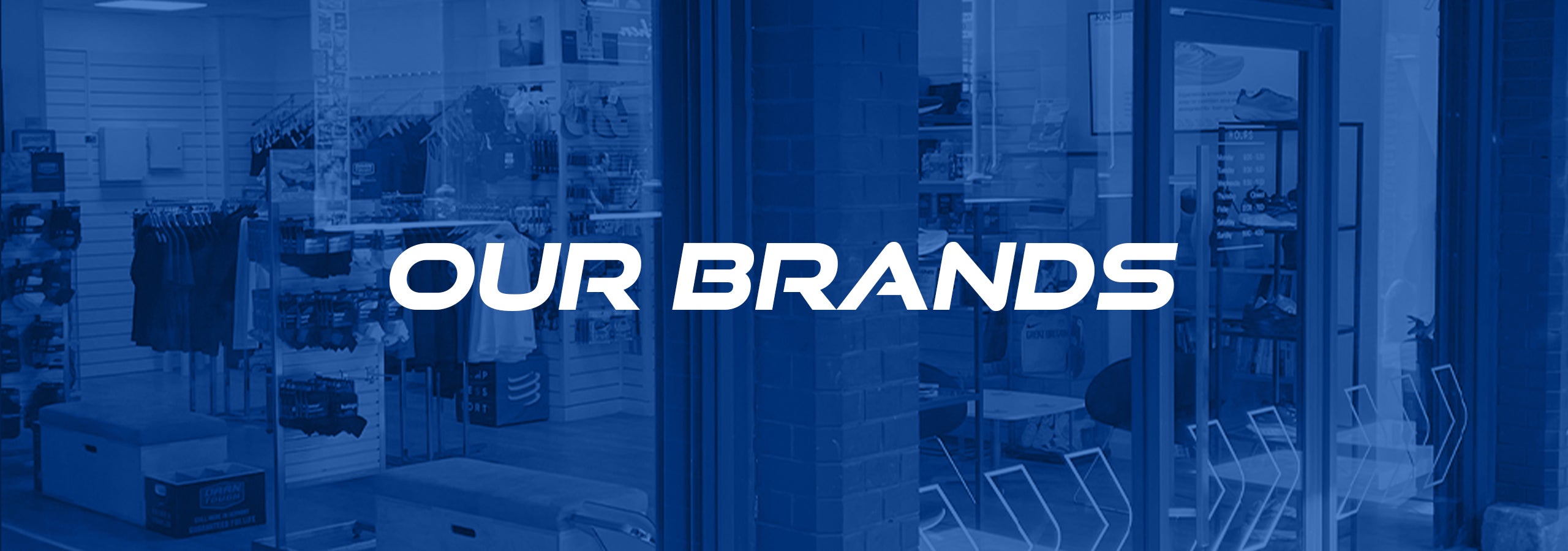 Image of the Kinisi shop interior with a text overlay reading 'our brands'