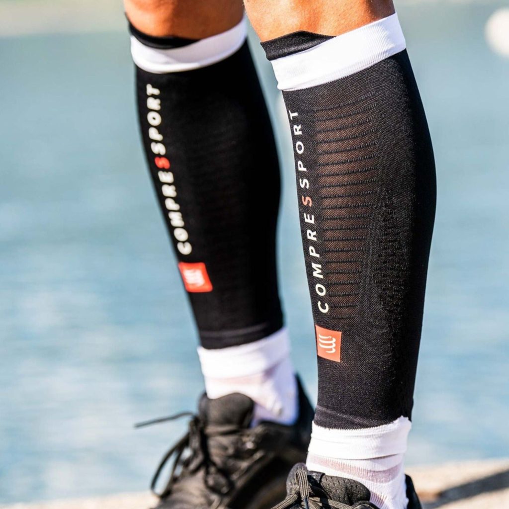 Calf sleeves provide targeted compression to the calf muscles to aid performance by reducing vibrations and muscle oscillation during movement.